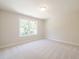 Neutral bedroom featuring plush carpeting and a window providing natural light at 1991 Deco Dr, Kennesaw, GA 30144