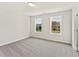 Bedroom with two windows, carpet, and natural light at 1991 Deco Dr, Kennesaw, GA 30144