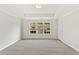 Spacious bedroom features a large window for natural light and neutral carpeting at 1991 Deco Dr, Kennesaw, GA 30144