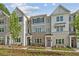 Charming townhomes with brick and siding facade, complemented by a well-maintained front lawn at 1991 Deco Dr, Kennesaw, GA 30144