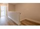 Hallway with wood flooring and white trim, showcasing the home's updated interior at 1991 Deco Dr, Kennesaw, GA 30144