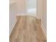 Hallway with appealing wood-look floors and bright white trim at 1991 Deco Dr, Kennesaw, GA 30144