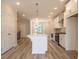 Spacious kitchen with large island, stainless steel appliances, and tile backsplash at 1991 Deco Dr, Kennesaw, GA 30144