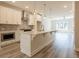 Open concept kitchen with island, pendant lighting, and stainless appliances at 1991 Deco Dr, Kennesaw, GA 30144
