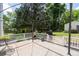 Back deck features a pergola, white railing, and garden views at 217 Colemans Bluff Dr, Woodstock, GA 30188