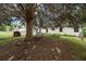 Secluded backyard featuring mature trees, a bench, and partial shade, ideal for relaxation and peaceful enjoyment at 217 Colemans Bluff Dr, Woodstock, GA 30188