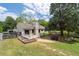 Charming home featuring a patio, raised garden beds, and a spacious backyard perfect for outdoor entertaining at 217 Colemans Bluff Dr, Woodstock, GA 30188