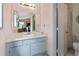 Bathroom with white sink, vanity and a view of the Main Bedroom at 217 Colemans Bluff Dr, Woodstock, GA 30188