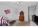 Bedroom features patriotic decor, a cozy chair and a pet bed at 217 Colemans Bluff Dr, Woodstock, GA 30188