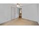 Bedroom with neutral carpet and adjacent bathroom and bedroom at 217 Colemans Bluff Dr, Woodstock, GA 30188