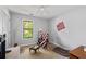 Bedroom features patriotic decor, a cozy chair and a comfortable bed for a pet at 217 Colemans Bluff Dr, Woodstock, GA 30188
