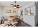 Light-filled dining room features a ceiling fan and convenient kitchen access at 217 Colemans Bluff Dr, Woodstock, GA 30188