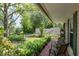 Inviting front porch with seating and beautiful landscaping, creating a welcoming entrance at 217 Colemans Bluff Dr, Woodstock, GA 30188