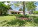 Single-story home with an attached two-car garage and a beautifully landscaped front yard at 217 Colemans Bluff Dr, Woodstock, GA 30188