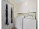Laundry room with washer, dryer, and storage cabinets at 217 Colemans Bluff Dr, Woodstock, GA 30188