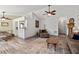 Open-concept living area with wood-look floors and a seamless flow to the dining space at 217 Colemans Bluff Dr, Woodstock, GA 30188