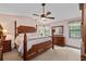 Spacious main bedroom features a vaulted ceiling, ceiling fan, and dark wood furniture at 217 Colemans Bluff Dr, Woodstock, GA 30188