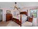 Spacious main bedroom features a vaulted ceiling, ceiling fan, and dark wood furniture at 217 Colemans Bluff Dr, Woodstock, GA 30188