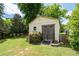Exterior view of a functional shed surrounded by greenery, offering additional storage and workspace at 217 Colemans Bluff Dr, Woodstock, GA 30188