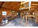 Well-equipped shed interior featuring ample workspace, storage shelves, and a ceiling fan for ventilation at 217 Colemans Bluff Dr, Woodstock, GA 30188