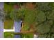 Aerial perspective of residence displaying a neatly manicured yard and mature tree coverage at 2720 Cavalier Dr, Decatur, GA 30034