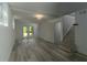 Finished basement with luxury vinyl flooring, neutral paint, and walkout access to the yard at 2720 Cavalier Dr, Decatur, GA 30034