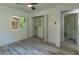 Bedroom with a ceiling fan, closet with custom shelving and drawers, and luxury vinyl flooring at 2720 Cavalier Dr, Decatur, GA 30034