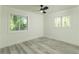 Bright bedroom with two large windows, ceiling fan, and modern finishes at 2720 Cavalier Dr, Decatur, GA 30034