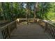 View from the deck showing the rails and surrounding trees and grass, along with the iron balusters at 2720 Cavalier Dr, Decatur, GA 30034