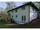 The backyard features a door to the basement, deck access, new landscaping, and a freshly painted foundation at 2720 Cavalier Dr, Decatur, GA 30034
