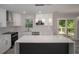 Modern kitchen featuring white cabinets, quartz countertops, stainless steel appliances, and a center island at 2720 Cavalier Dr, Decatur, GA 30034