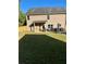 A spacious backyard with a covered patio, and a new wooden fence at 5637 Valley Loop, Fairburn, GA 30213