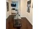 Elegant entryway featuring hardwood floors, modern art, and a view into the open-concept living space at 5637 Valley Loop, Fairburn, GA 30213