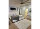 Bright bedroom features a king-sized bed, white comforter, plush area rug, and ceiling fan, offering comfort and style at 5637 Valley Loop, Fairburn, GA 30213