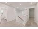 Hallway with carpet and railing on second floor at 7127 Brushwood Bend (Lot 44), Lithonia, GA 30058