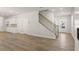 Inviting living room with wood floors and a staircase leading to the upper level at 7127 Brushwood Bend (Lot 44), Lithonia, GA 30058