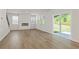 Bright living room with hardwood floors, fireplace, and sliding glass doors at 7127 Brushwood Bend (Lot 44), Lithonia, GA 30058