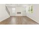 Modern living room with hardwood floors, fireplace, and ample natural light at 7127 Brushwood Bend (Lot 44), Lithonia, GA 30058
