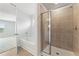 Bright bathroom featuring a separate tub and shower, as well as an open doorway to the bedroom at 7133 Brushwood Bend (Lot 43), Lithonia, GA 30058