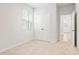 Bright bedroom features neutral carpet, a window with blinds, and a double-door closet for ample storage at 7133 Brushwood Bend (Lot 43), Lithonia, GA 30058