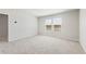 Bright, neutral bedroom with large windows, plush carpeting, and ample natural light, creating a cozy and inviting atmosphere at 7133 Brushwood Bend (Lot 43), Lithonia, GA 30058