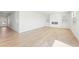 Spacious living room boasts hardwood floors, a modern fireplace, and two windows for natural light at 7133 Brushwood Bend (Lot 43), Lithonia, GA 30058