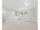 Upstairs loft area features neutral walls and carpets, as well as natural light from the window at 7133 Brushwood Bend (Lot 43), Lithonia, GA 30058