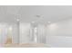 Loft area boasts neutral walls and carpet, as well as access to secondary rooms and recessed lighting at 7133 Brushwood Bend (Lot 43), Lithonia, GA 30058