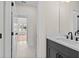 Bathroom featuring a modern vanity, fixtures, and an attached hallway at 11350 Bennett Ln, Johns Creek, GA 30097