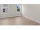 Bright bedroom with neutral paint and luxury vinyl plank flooring at 11350 Bennett Ln, Johns Creek, GA 30097