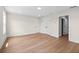Bright bedroom with light wood flooring and multiple white doors, offering a clean and modern look at 11350 Bennett Ln, Johns Creek, GA 30097
