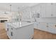 The kitchen is large with two islands and sleek appliances at 11350 Bennett Ln, Johns Creek, GA 30097