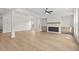 Spacious open-concept living room with a fireplace at 11350 Bennett Ln, Johns Creek, GA 30097