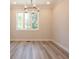 Bright dining room with hardwood floors and a window with backyard views at 1979 Deco Dr, Kennesaw, GA 30144